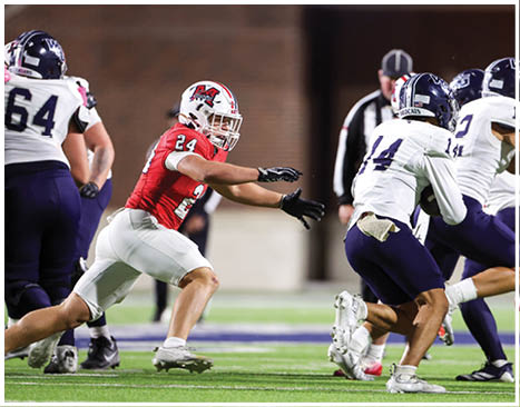 A football player running on the field. Description generated by AI