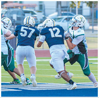 A football player is sliding on the ground. Description generated by AI