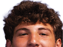 A young man wearing a white jersey with the number 10 on it. Description generated by AI