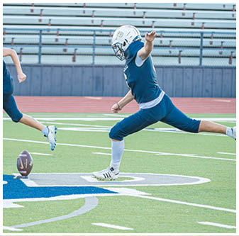 A football player is sliding on the ground. Description generated by AI