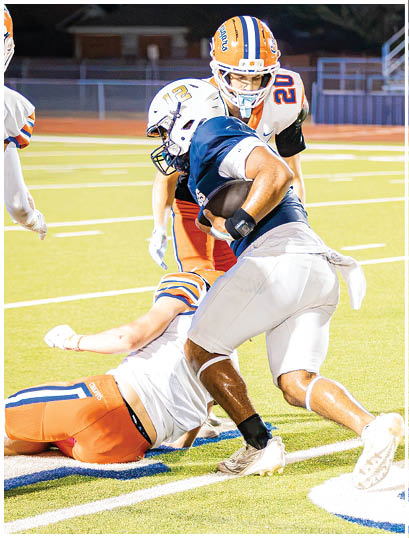 A football player wearing a blue and white uniform. Description generated by AI