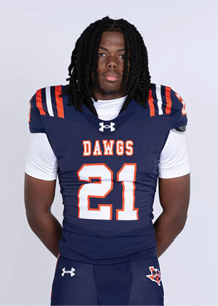 A young man wearing a white and black jersey with the number 14 on it. Description generated by AI