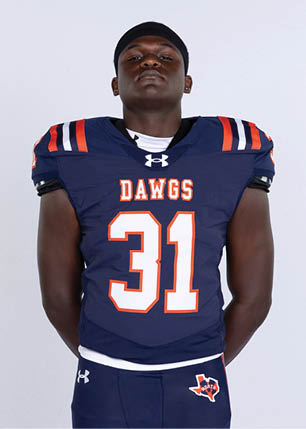 A young man wearing a white and black jersey with the number 14 on it. Description generated by AI