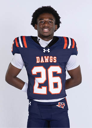A young man wearing a white and black jersey with the number 14 on it. Description generated by AI