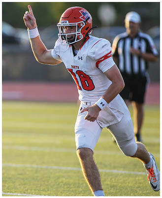 A football player wearing a blue and white uniform. Description generated by AI