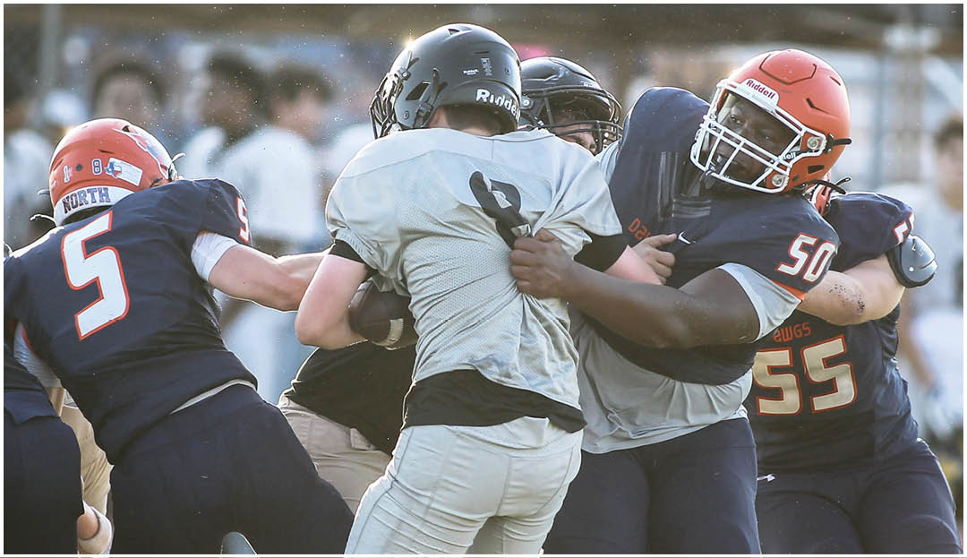 A football player wearing a blue and white uniform. Description generated by AI