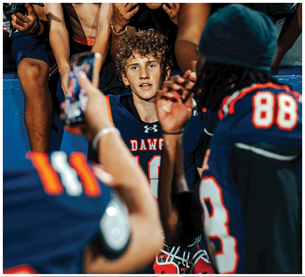 A football player running on the field. Description generated by AI