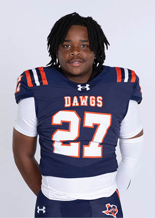 A young man wearing a white and black jersey with the number 14 on it. Description generated by AI