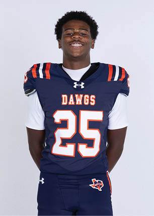 A young man wearing a white and black jersey with the number 14 on it. Description generated by AI