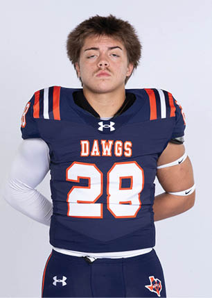 A young man wearing a white and black jersey with the number 14 on it. Description generated by AI