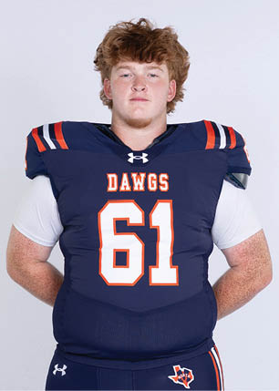 A young man wearing a white and black jersey with the number 14 on it. Description generated by AI