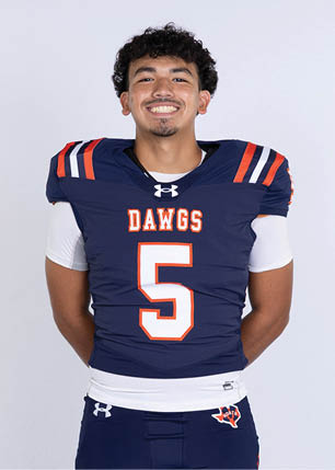 A young man wearing a white and black jersey with the number 14 on it. Description generated by AI