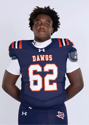 A young man wearing a white and black jersey with the number 14 on it. Description generated by AI