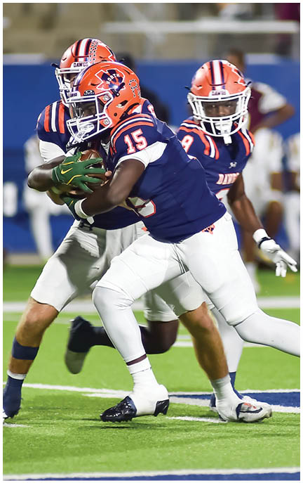 A football player running on the field. Description generated by AI