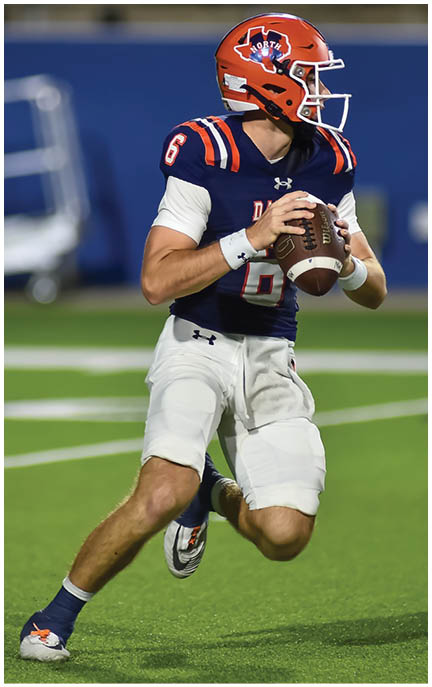 A football player running on the field. Description generated by AI