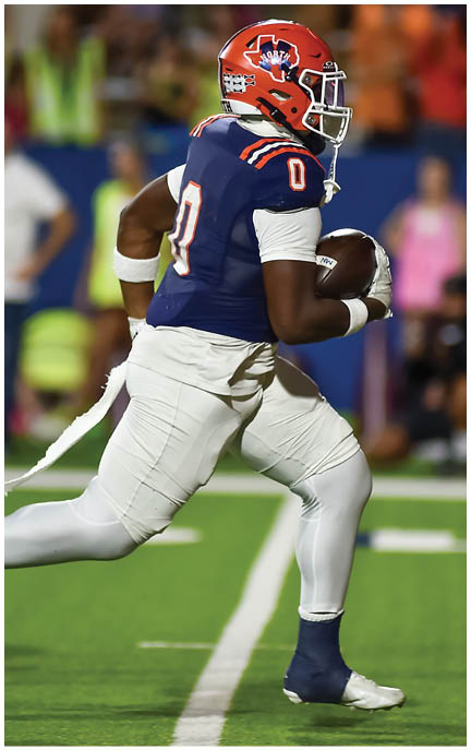 A football player running on the field. Description generated by AI