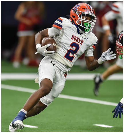 A football player running on the field. Description generated by AI