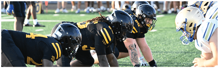 A football player is sliding on the ground. Description generated by AI