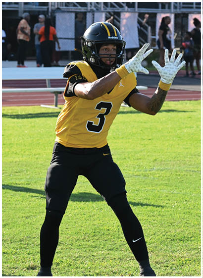 A football player wearing a blue and white jersey with the number 78 on it. Description generated by AI