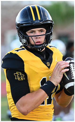 A football player running on the field. Description generated by AI
