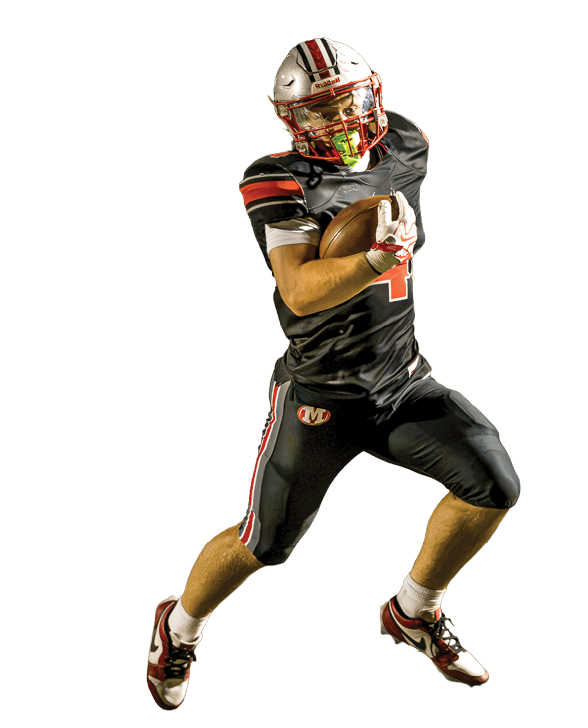 A person wearing a black football uniform with red and white stripes is running on a field while holding a football securely. Descripci n generada con IA