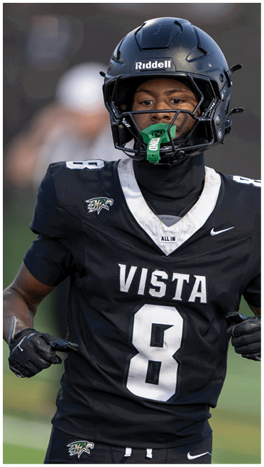 A close-up of the front part of a dark blue helmet with a partially visible white and black logo. Description generated by AI