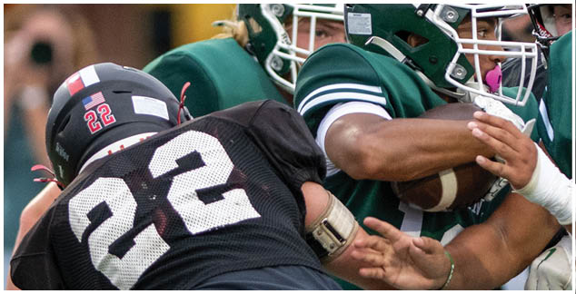 A group of football players in green and white uniforms. Description generated by AI