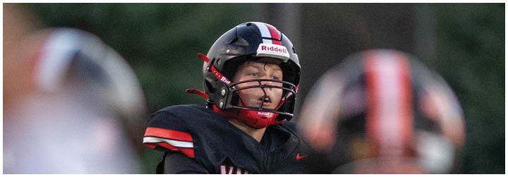 A football player wearing a black jersey with the number 13 on it. Description generated by AI