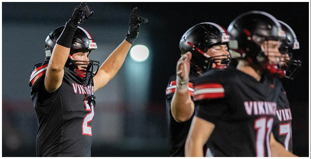 A football player with the number 2 on his jersey celebrates. Description generated by AI