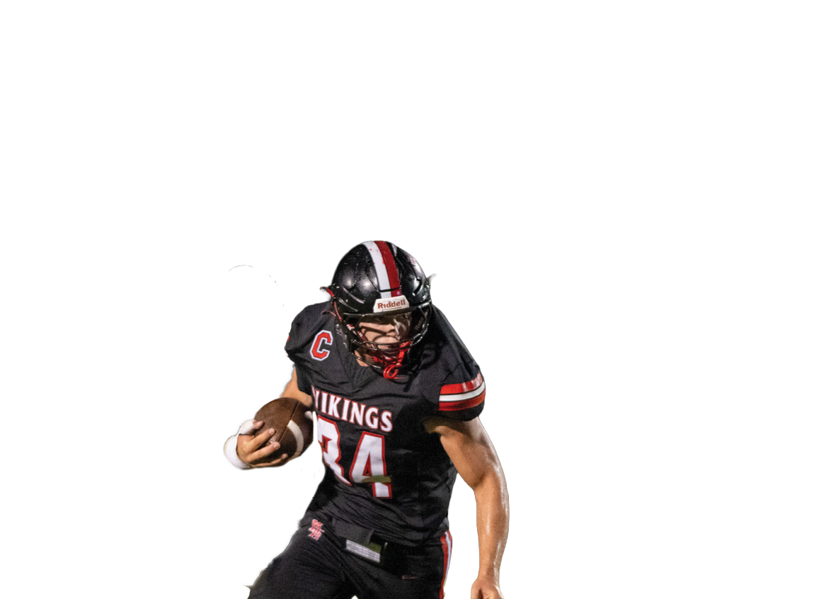A man wearing a black jersey with the number 24 on it. Description generated by AI