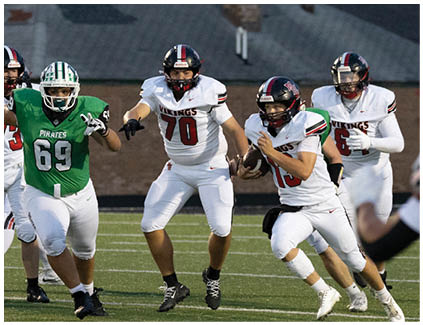 A football player wearing a green jersey. Description generated by AI