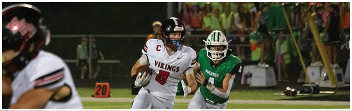 A football game is taking place with two teams playing. Description generated by AI