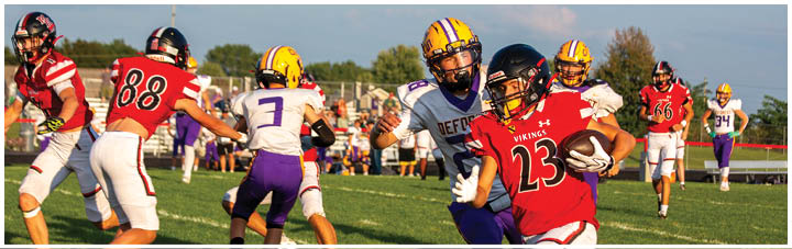 A football game is being played on a field. Description generated by AI