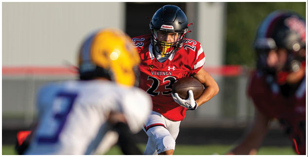 A football player in a red jersey with the number 42 on it. Description generated by AI