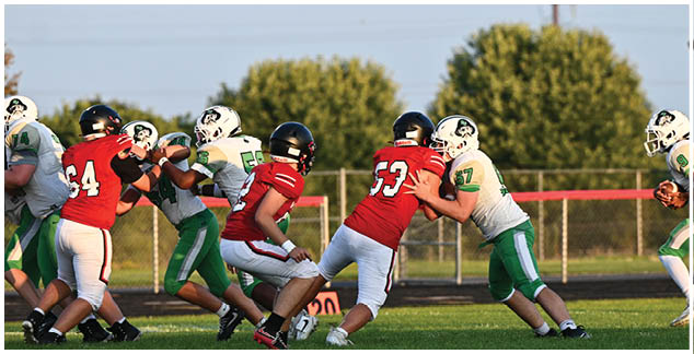 A football game is being played on a field. Description generated by AI