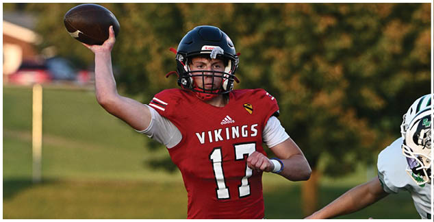 A football player in a red jersey with the number 17 on it. Description generated by AI