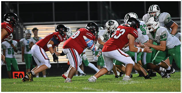 A football game is being played on a field. Description generated by AI
