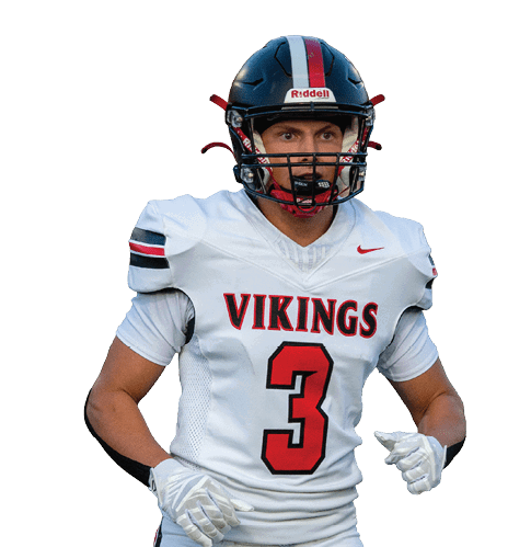 A man wearing a white jersey with the number 3 on it. Description generated by AI