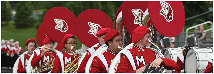 A group of people wearing red and white uniforms. Description generated by AI