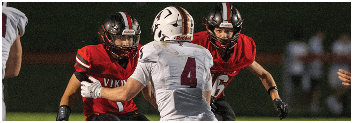 A football player in a white jersey with the number 4 on it. Description generated by AI