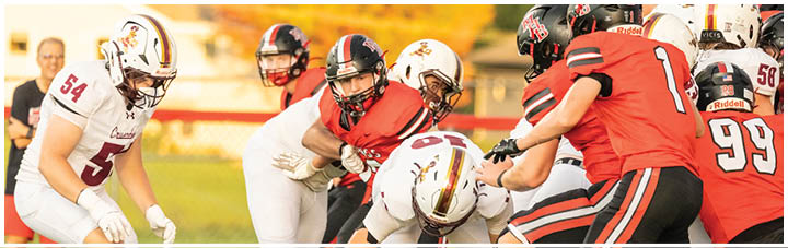 A group of football players on the field. Description generated by AI