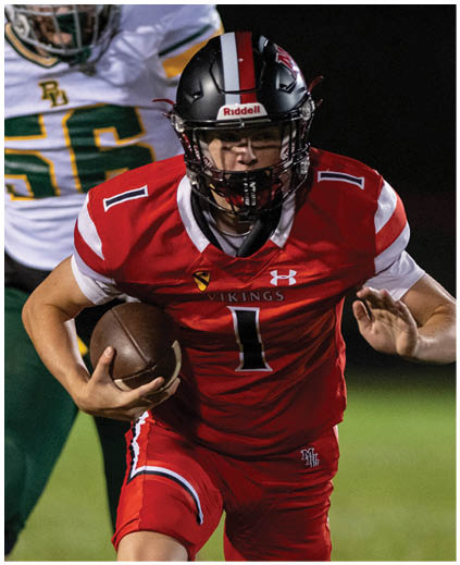 A football player in a red jersey with the number 1 on it. Description generated by AI