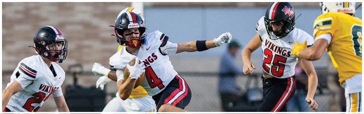 A football player in a white jersey with the number 2 on it. Description generated by AI