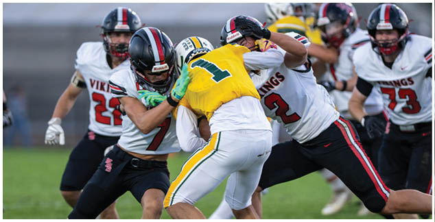 A football player in a white jersey with the number 22 on it. Description generated by AI