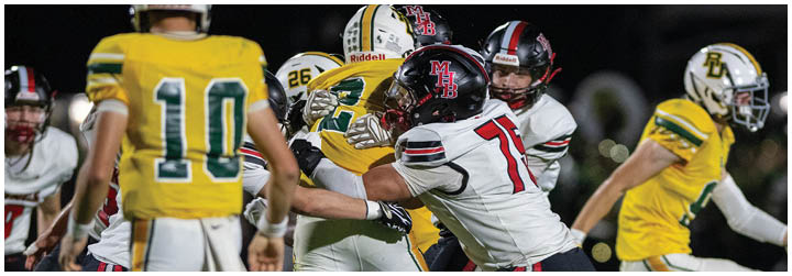 A football game is being played with two teams on the field. Description generated by AI
