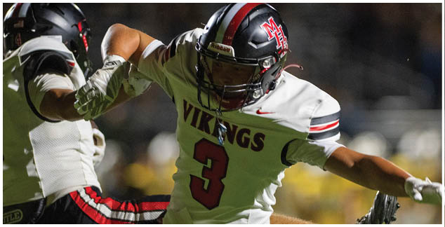 A football player wearing a white jersey with the number 3 on it. Description generated by AI