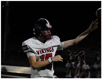 A football player wearing a white jersey with the number 17 on it. Description generated by AI