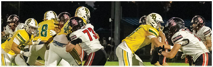 A group of football players on a field. Description generated by AI
