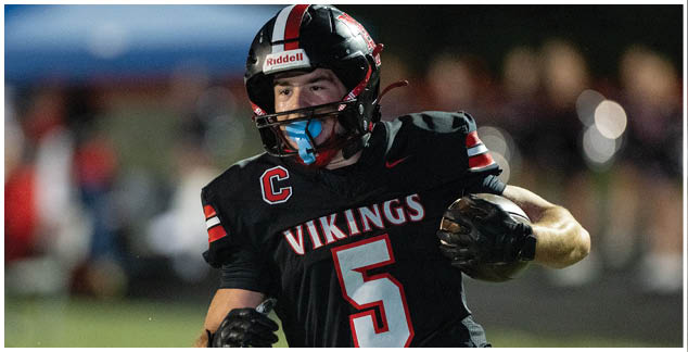 A football player wearing a white jersey with the number 3 on it. Description generated by AI