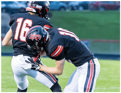 A football player wearing a white jersey with the number 17 on it. Description generated by AI
